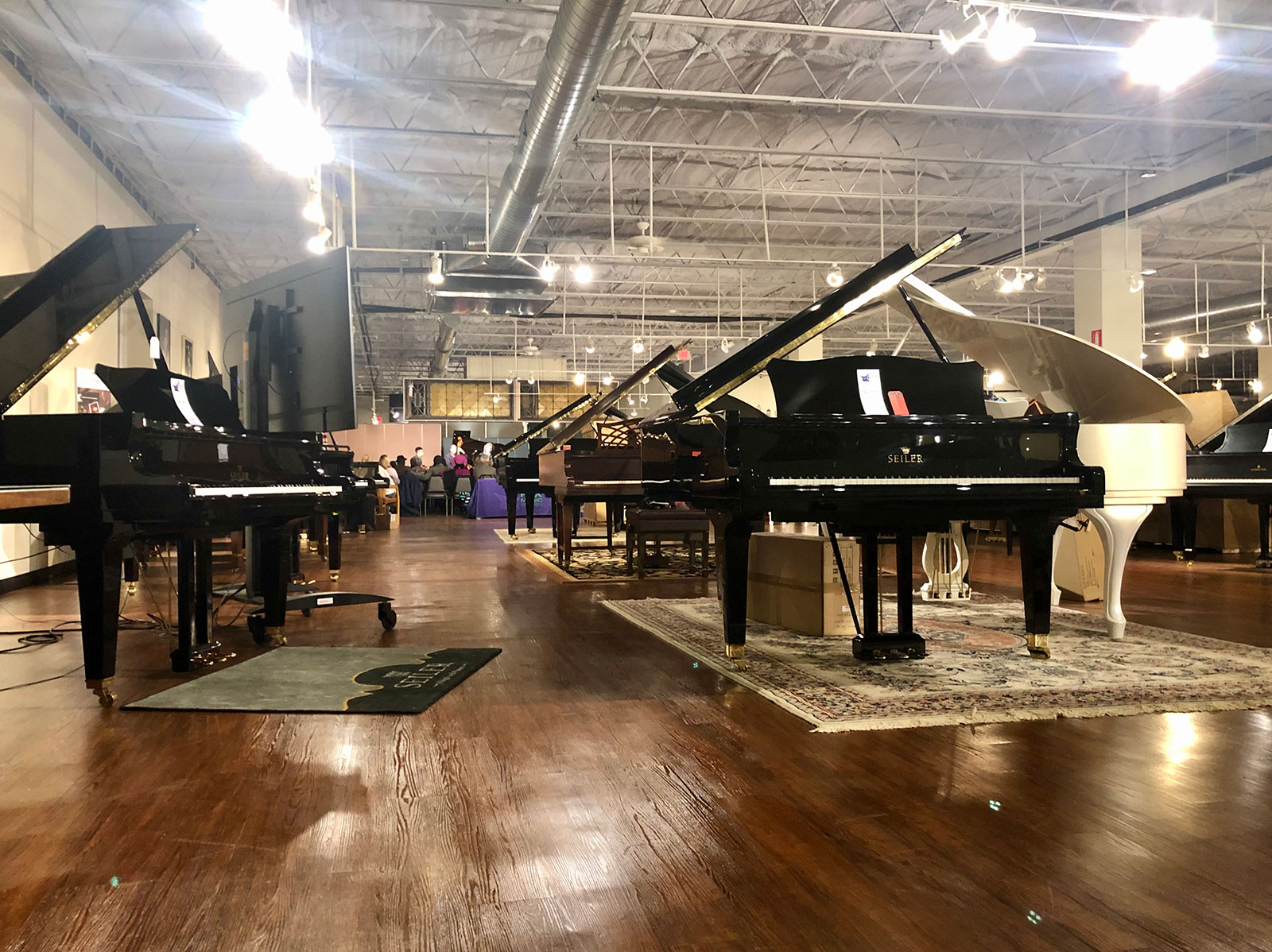 piano-showcase-w-audience-in-background.jpg